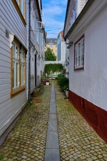 Historic town centre of Bergen with narrow streets and cobblestones surrounded by traditional