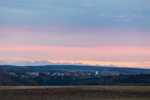 Alpine panorama near Magolsheim. Säntis, Swiss Alps at sunset with a view of Mehrstetten. View from
