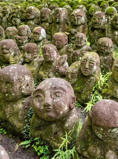 Moss-covered stone statues of rakans, the disciples of Buddha, Otagi Nenbutsu-ji temple, Kyoto,