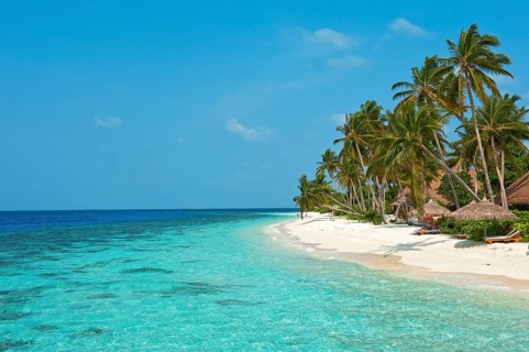 View of beach with turquoise blue water in shallow lagoon of Maldives island Filaidhoo in Indian