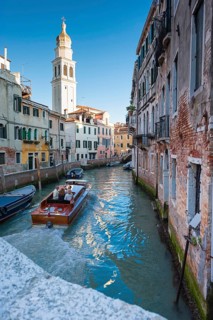 Tourist boat in the old town with San Girgio dei Greci, church, city trip, holiday, travel,