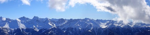 Alpine panorama with snow-covered mountain peaks in winter. Taken in the ski resort of Serfaus Fiss