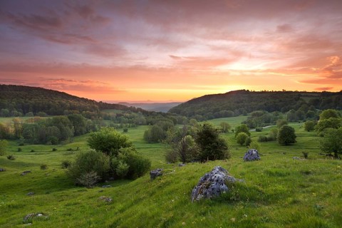 Randecker Maar on the Swabian Alb. Beautiful sunrise with the Drei Kaiser mountains in the distance
