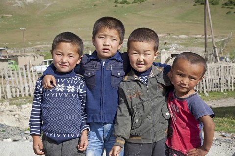 Four young Kyrgyz boys showing Chinese features, Osh Province, Kyrgyzstan, Asia