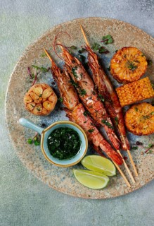 Langoustines on skewers, shrimp kebab, with fried corn, spices and herbs, homemade, no people