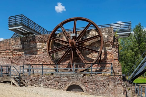 Big winding wheel from colliery headframe at Le Bois du Cazier, coal mining museum at Marcinelle