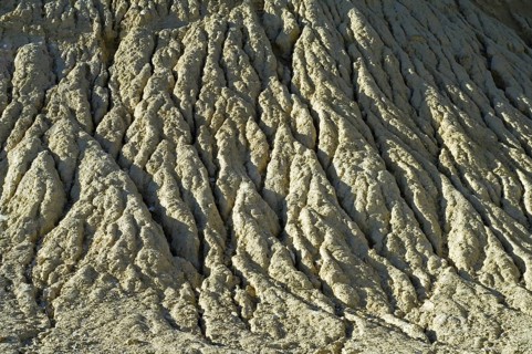 Gullies in soft rock of cliff caused by rain water erosion
