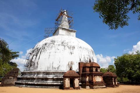 Sri Lankan workers at the Kiri Vehera stupa in the ruined city of Polonnaruwa, Central Province,
