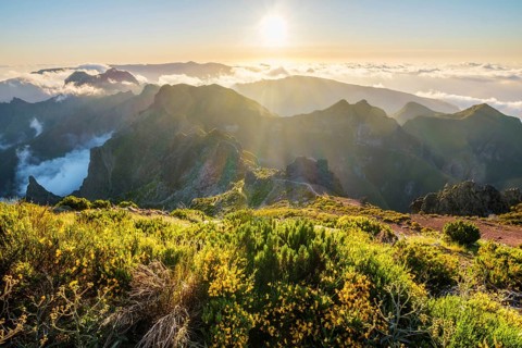 View of mountains over clouds from Pico Ruivo on sunset. Madeira island, Portugal, Europe