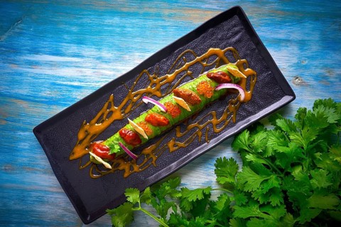 Modern guacamole avocado sauce with fresh coriander