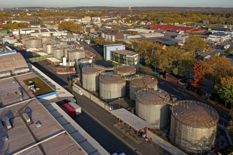 Stainless steel tanks storing chemicals at the Rhine river in Germany. The Chemicals are being
