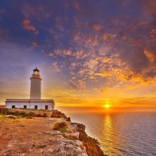 La Mola Cape Lighthouse Formentera at sunrise in Balearic Islands