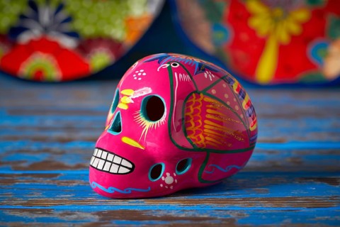 Mexican pink skull dia muertos crafts in Mexico of deaths day