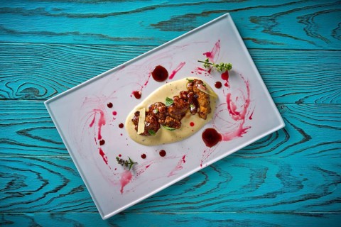 Lamb gizzard recipe on a cream modern cuisine presentation