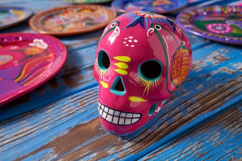Mexican pink skull dia muertos crafts in Mexico of deaths day