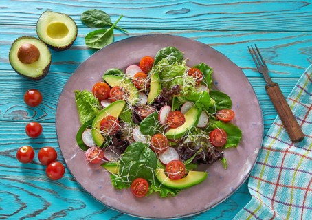 Avocado salad with sprouts tomatoes spinach and radish healthy food
