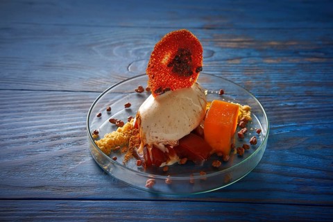 Modern cuisine ice cream dessert with quince vanilla and crunchy