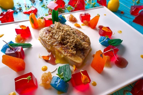 Foie slice with grated white truffle and colorful jelly decoration