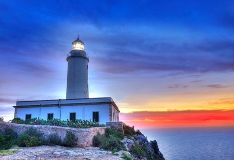 La Mola Cape Lighthouse Formentera at sunrise in Balearic Islands