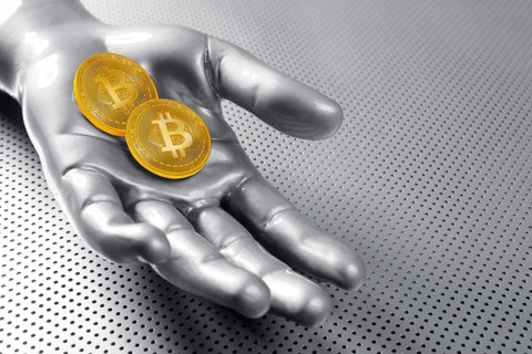 Bitcoin BTC cryptocurrency on silver futuristic hand