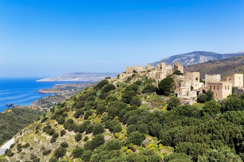 Picturesque residential towers with holiday flats and hotels, historic village of Vathia, view of