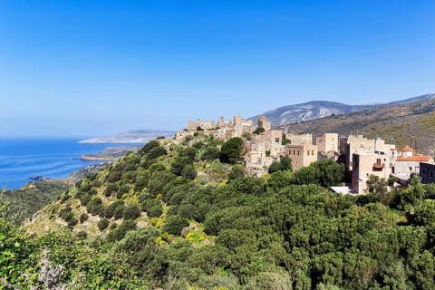 Picturesque residential towers with holiday flats and hotels, historic village of Vathia, view of