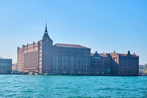 View from the water on Hilton Hotel beside the water in Venice on a sunny day in winter, Italy,