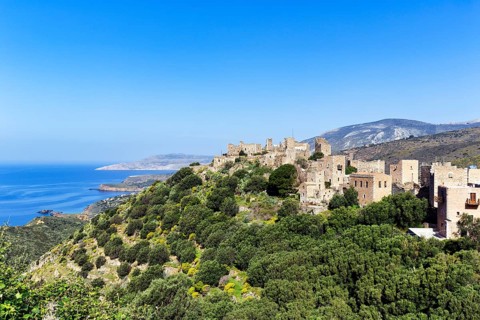 Picturesque residential towers with holiday flats and hotels, historic village of Vathia, view of