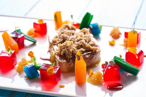 Foie slice with grated white truffle and colorful jelly decoration