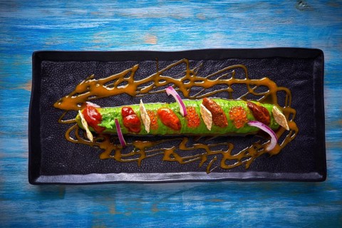 Modern guacamole avocado sauce with fresh coriander