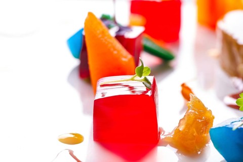 Jelly colorful fruits gelatine on white background