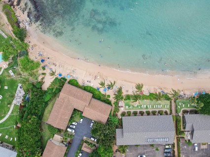 Aerial view of tropical destination with white sand and turquoise water. Kapalua coast in Maui,