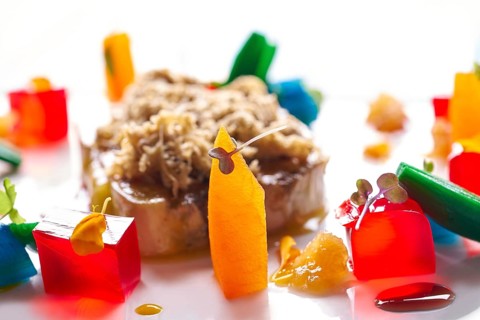 Foie slice with grated white truffle and colorful jelly decoration