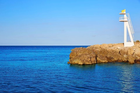Denia Las Rotas Trampoli beach and tower in Mediterranean Spain Alicante