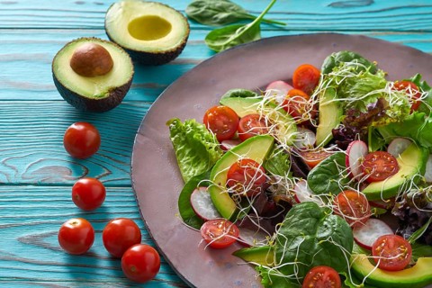 Avocado salad with sprouts tomatoes spinach and radish healthy food