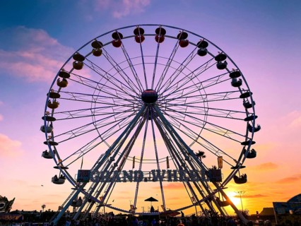 Ferris wheel, bottom view of a Ferris wheel during sunset. San DIego County Fair, California, USA.