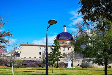 Valencia Turia river park with San Pio V museum dome in background at Spain