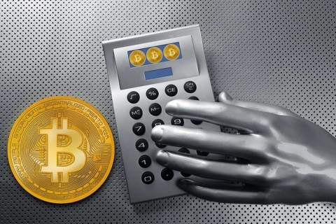 Calculator with bitcoin btc coin and futuristic silver hand