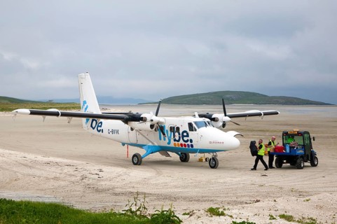 Flybe plane on sandy airstrip Isle of Barra airport, Barra, Outer Hebrides, Scotland, UK
