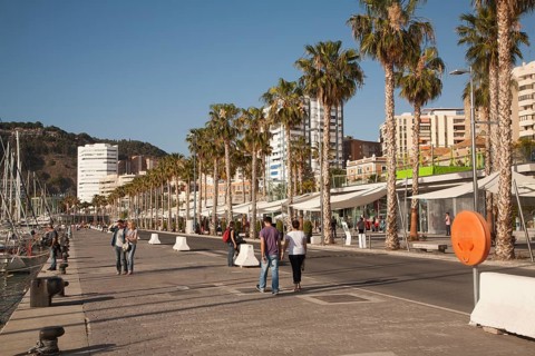People walking in the newly redeveloped port area of shops and bars Malaga, Spain, Muelle dos,