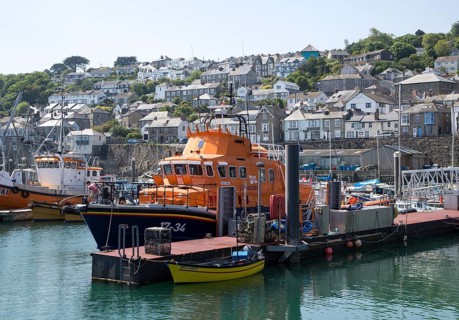 RNLI lifeboat in the harbour of fishing port of Newlyn, Cornwall, England, UK