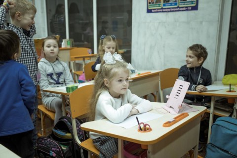 Pupils in a classroom in one of the metro schools in Kharkiv. Classrooms were set up in various
