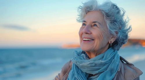 Happy senior woman enjoying walk on the beach and happy retirement, AI generated