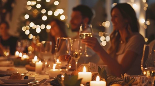 A group of people are sitting around a table with plates of food and celebrating, AI generated