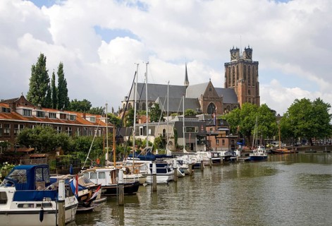 Grote Kerk cathedral church and boats in Nieuwe Haven, Dordrecht, Netherlands