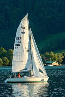 Sailing boat on the Tegernsee, warm evening light, Mangfall mountains, Bavarian Prealps, Alps,