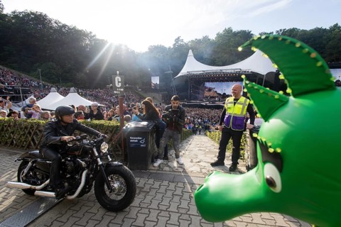 Peter Maffay rides past Tabaluga on his Harley Davidson in front of his concert on We Love Rock 'n'