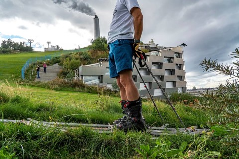 CopenHill, waste incineration plant and artificial ski slope, skiing with a view of the ski lift,