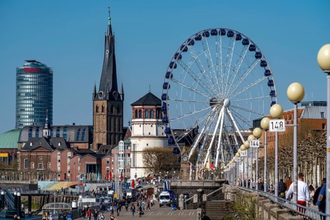 Rhine promenade in Düsseldorf, Ferris wheel, old castle tower, St Lambert's basilica, old town,