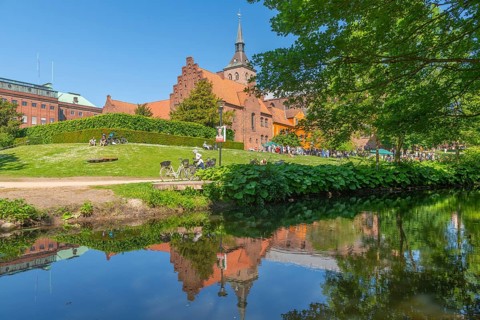 Odense, green area, monastery, brick building, stepped gable, tower of the cathedral church, St.